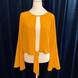 Yellow, black polka dotted long sleeve bell sleeve top